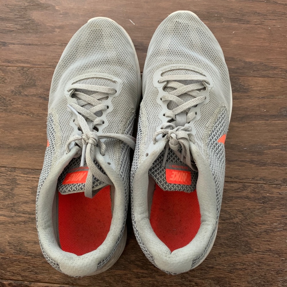 Nike Revolution 3 shoes in orange and gray, size 9